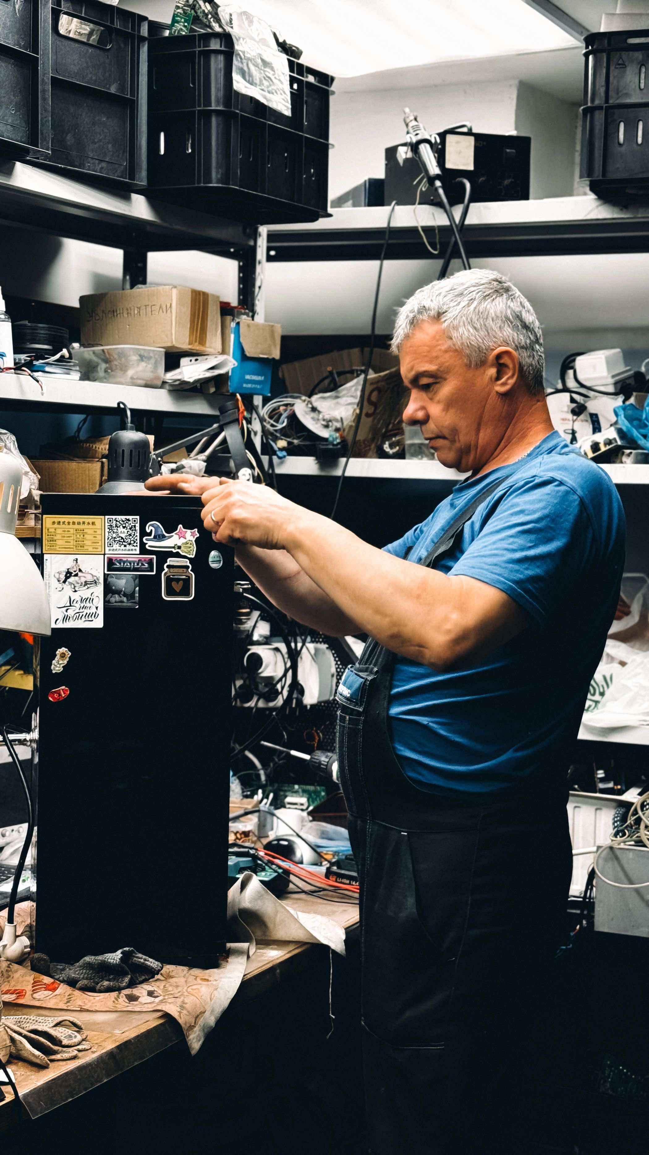 A technician working through a practical process at a workbench